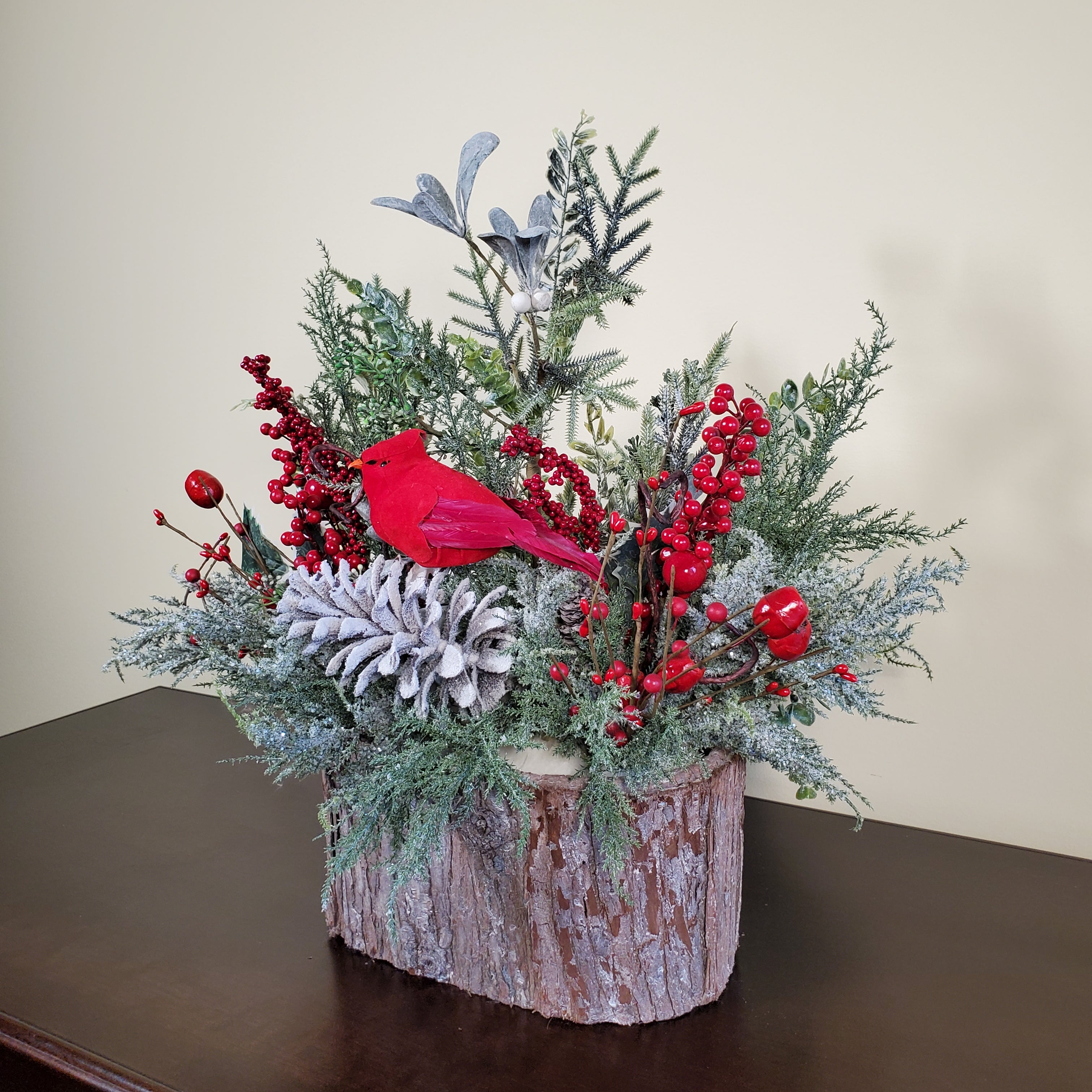 Cardinal Christmas Arrangement with Frosted Pine, Red Berries, and Winter Greens in Bark-Style Container