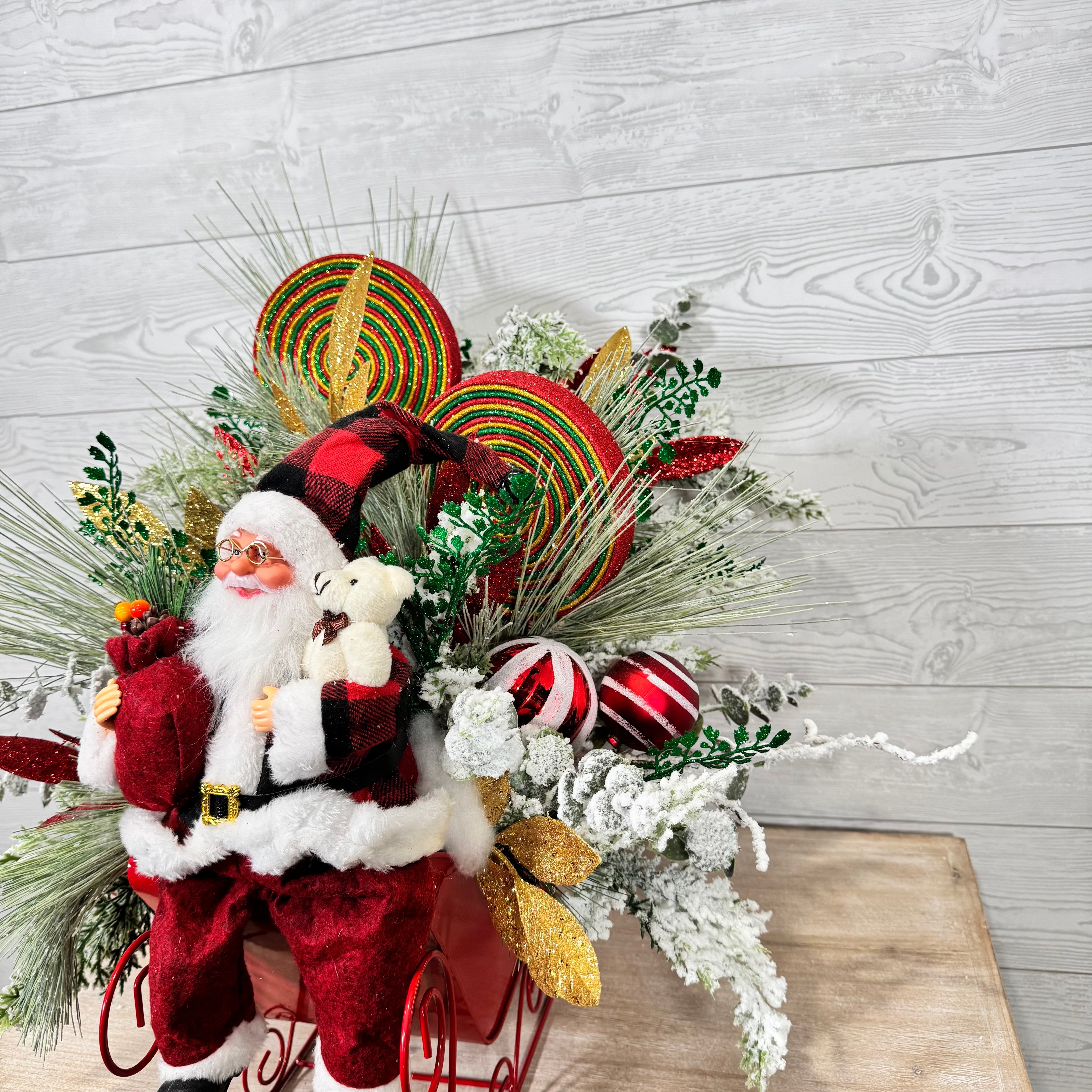 Santa Sleigh Christmas Centerpiece, Whimsical Holiday Arrangement with Plaid Santa, Lollipops & Frosted Greenery