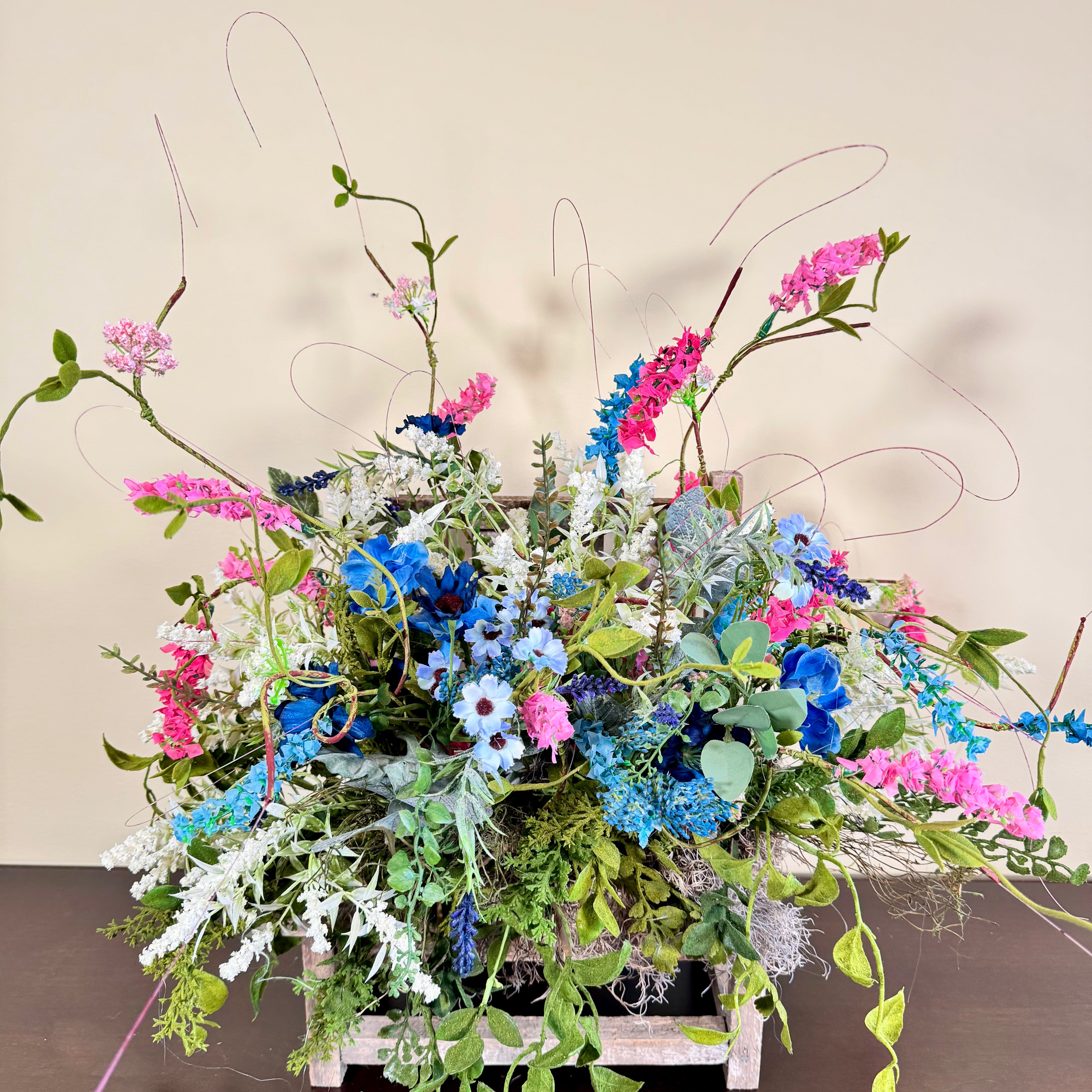 Wildflower Meadow Arrangement with Pink and Blue Blooms on Weathered Wooden Bench