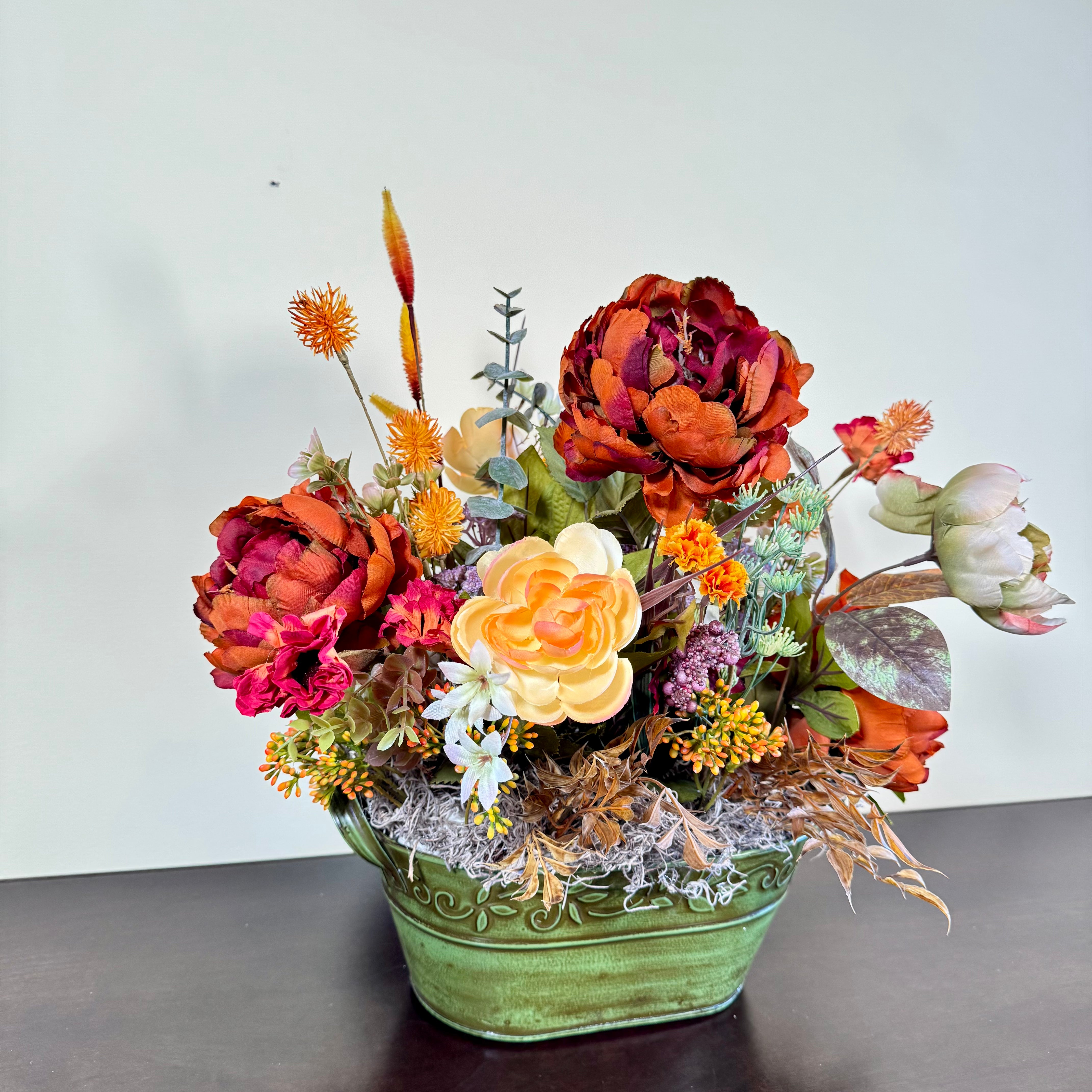 Fall Floral Arrangement with Peonies Roses and Autumn Accents in Green Embossed Tin