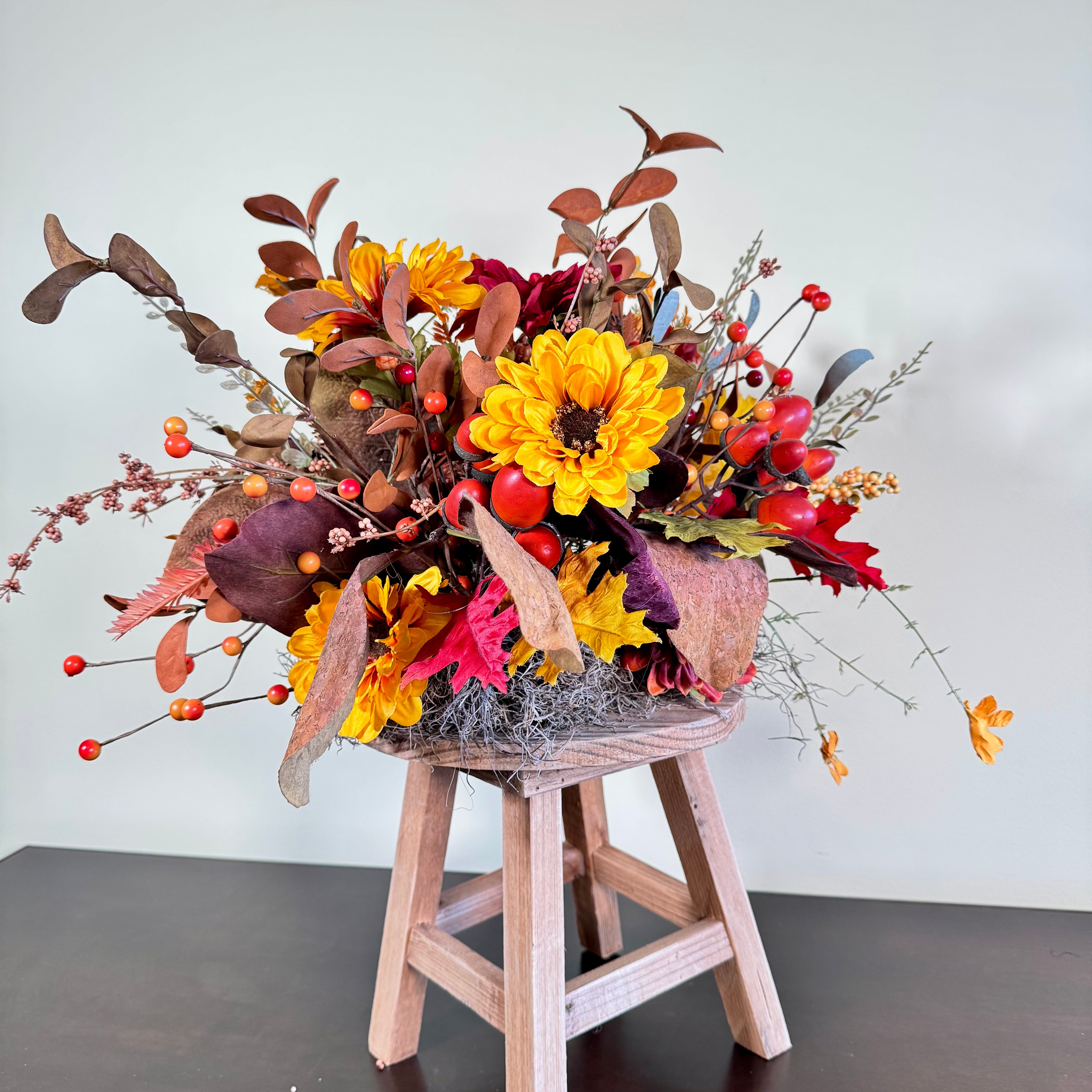 Fall Floral Arrangement with Sunflowers Berries and Leaves on Rustic Wood Stand