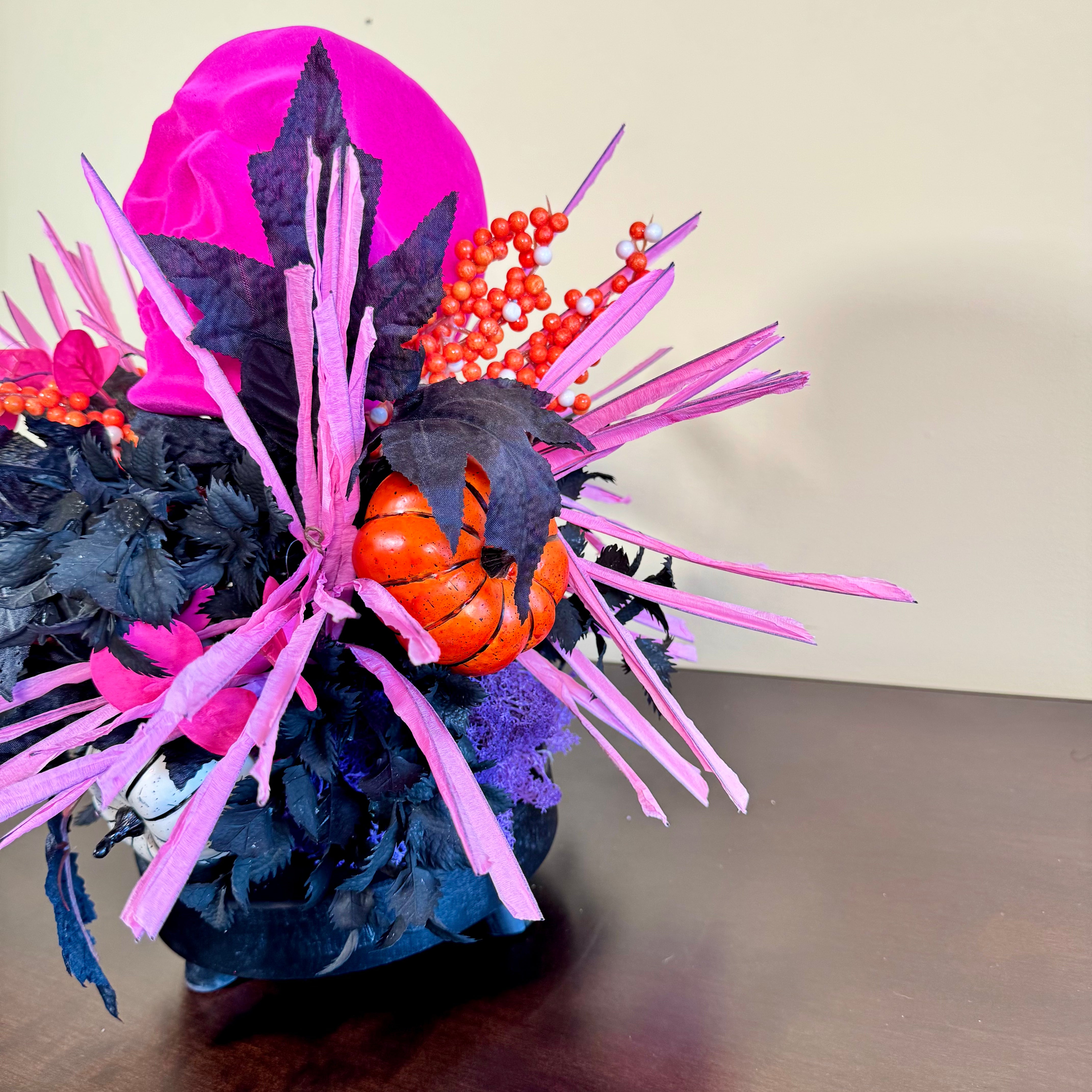 Pink Skull Halloween Arrangement with Black Foliage, Pumpkins and Neon Accents