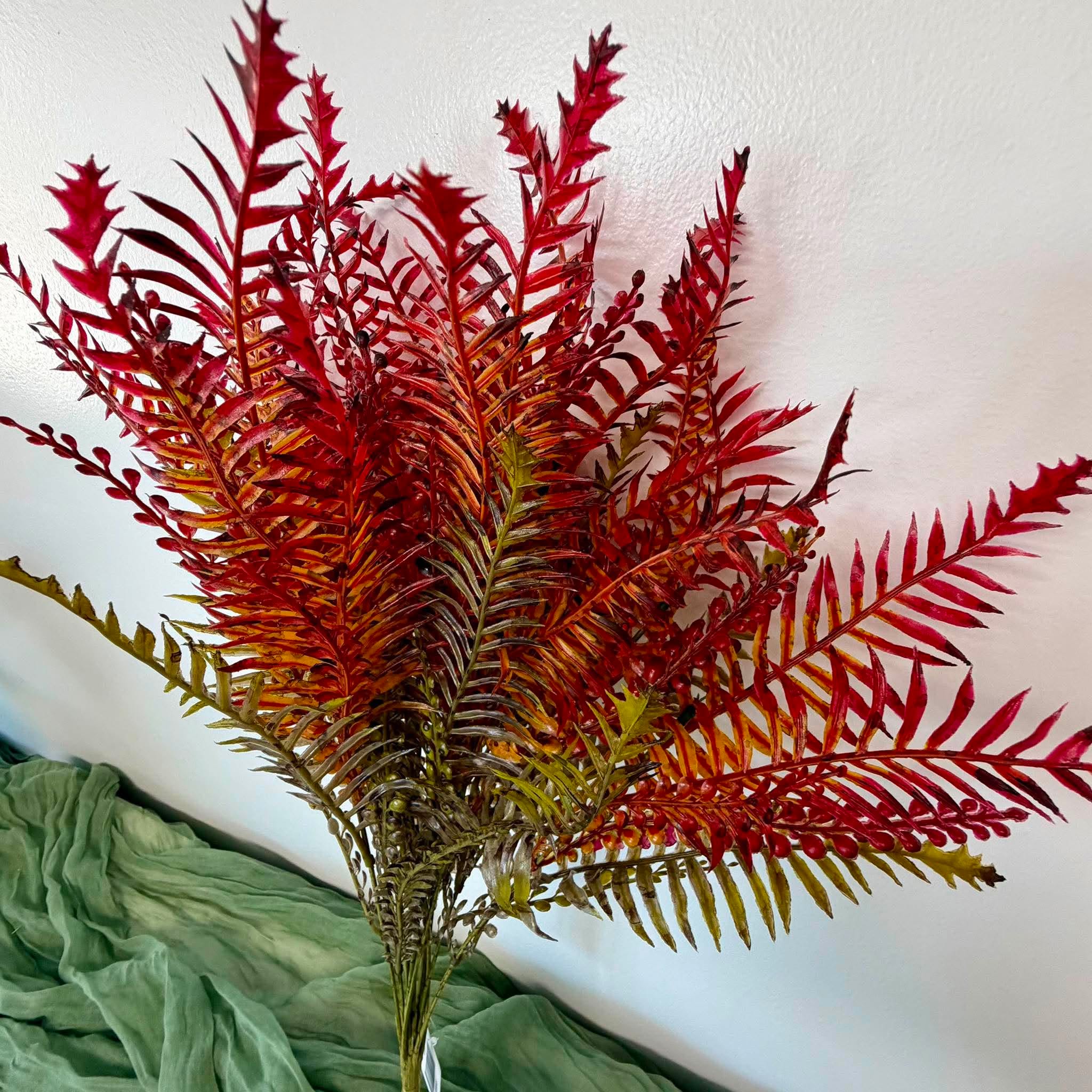 Close Up of Red Rust and Olive Fern Fronds with Berry Sprigs on Fall Wreath Bush