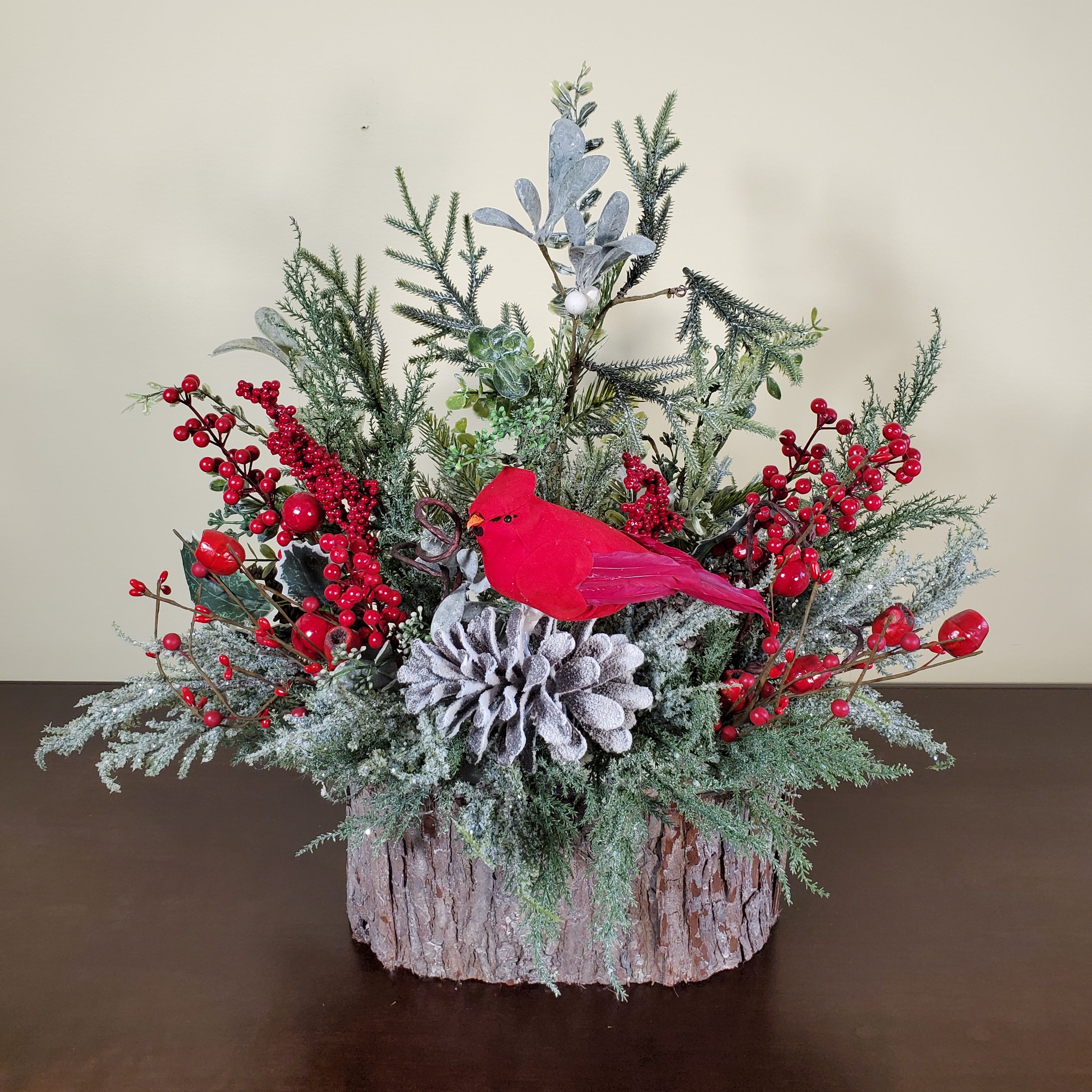 Cardinal Christmas Arrangement with Frosted Pine, Red Berries, and Winter Greens in Bark-Style Container