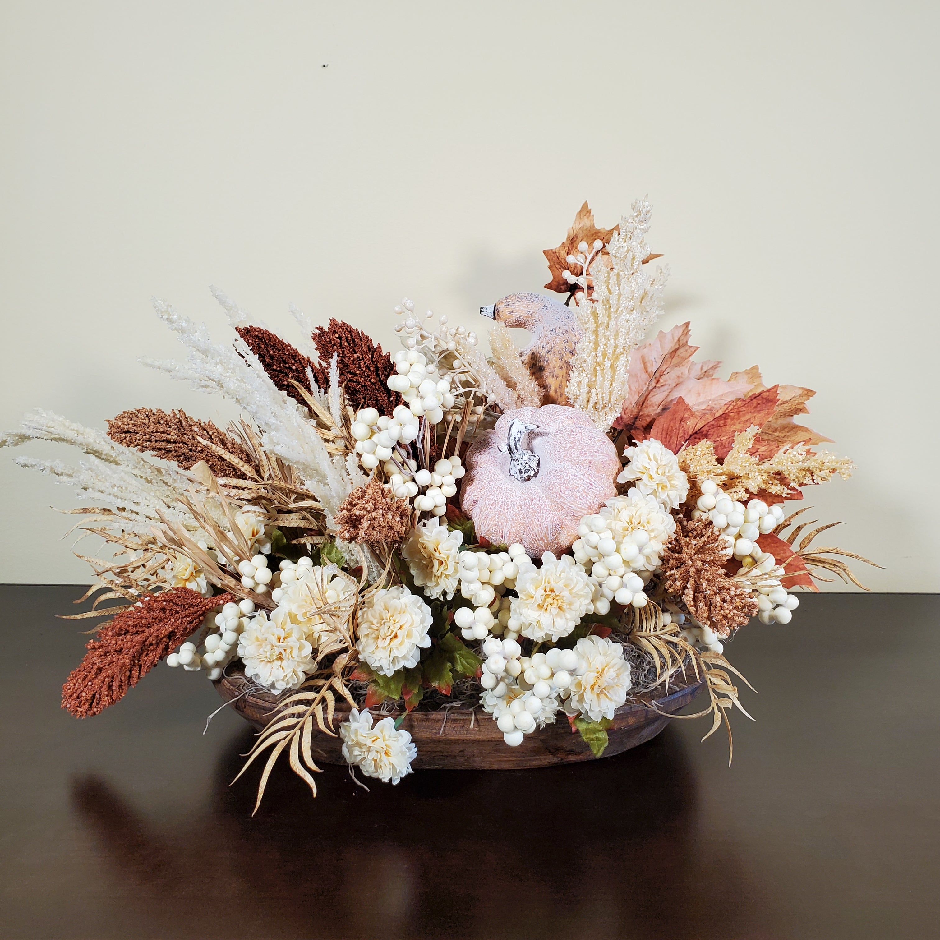 Neutral Fall Pumpkin Centerpiece with Cream Florals, White Berries, and Autumn Grasses in Rustic Oval Base