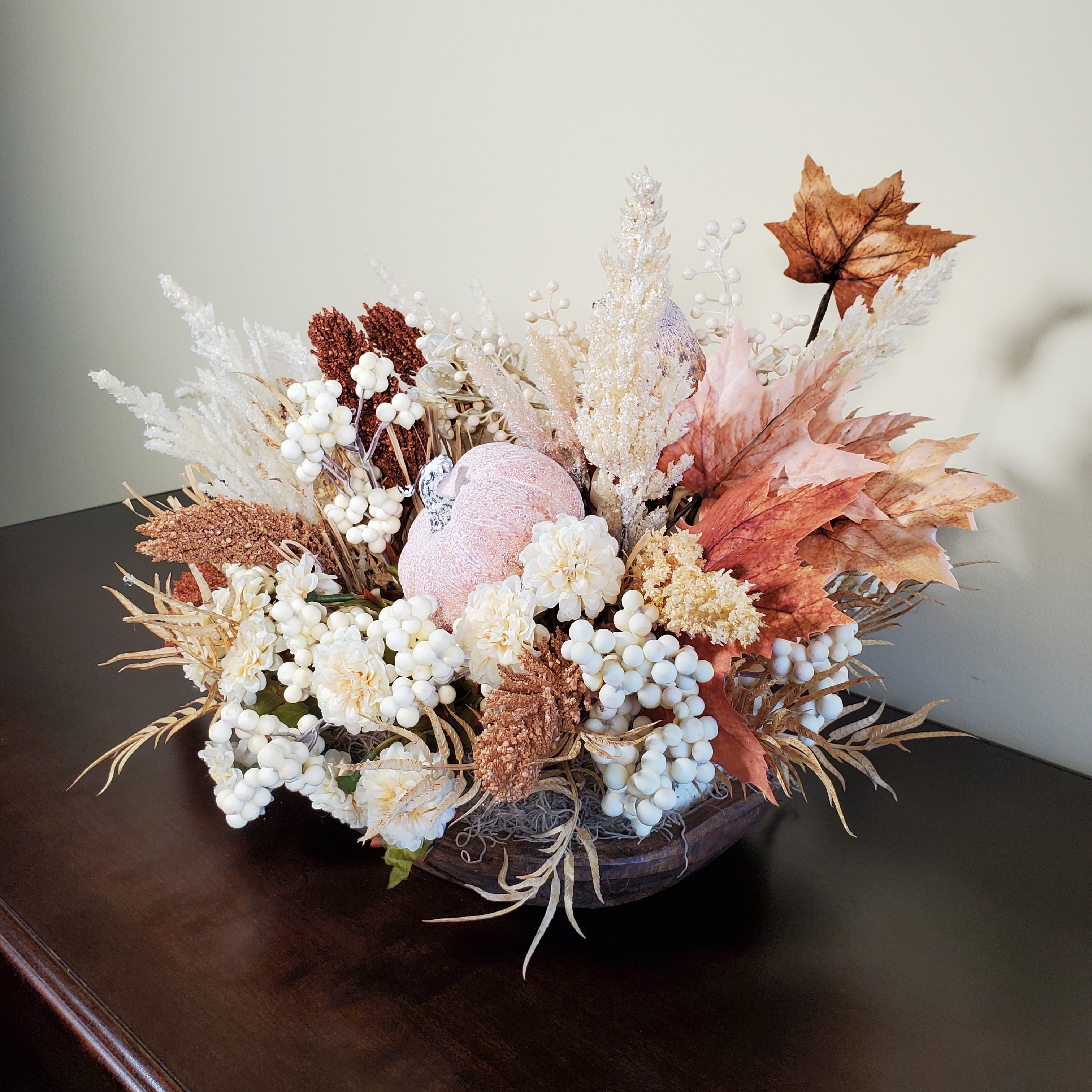 Neutral Fall Pumpkin Centerpiece with Cream Florals, White Berries, and Autumn Grasses in Rustic Oval Base