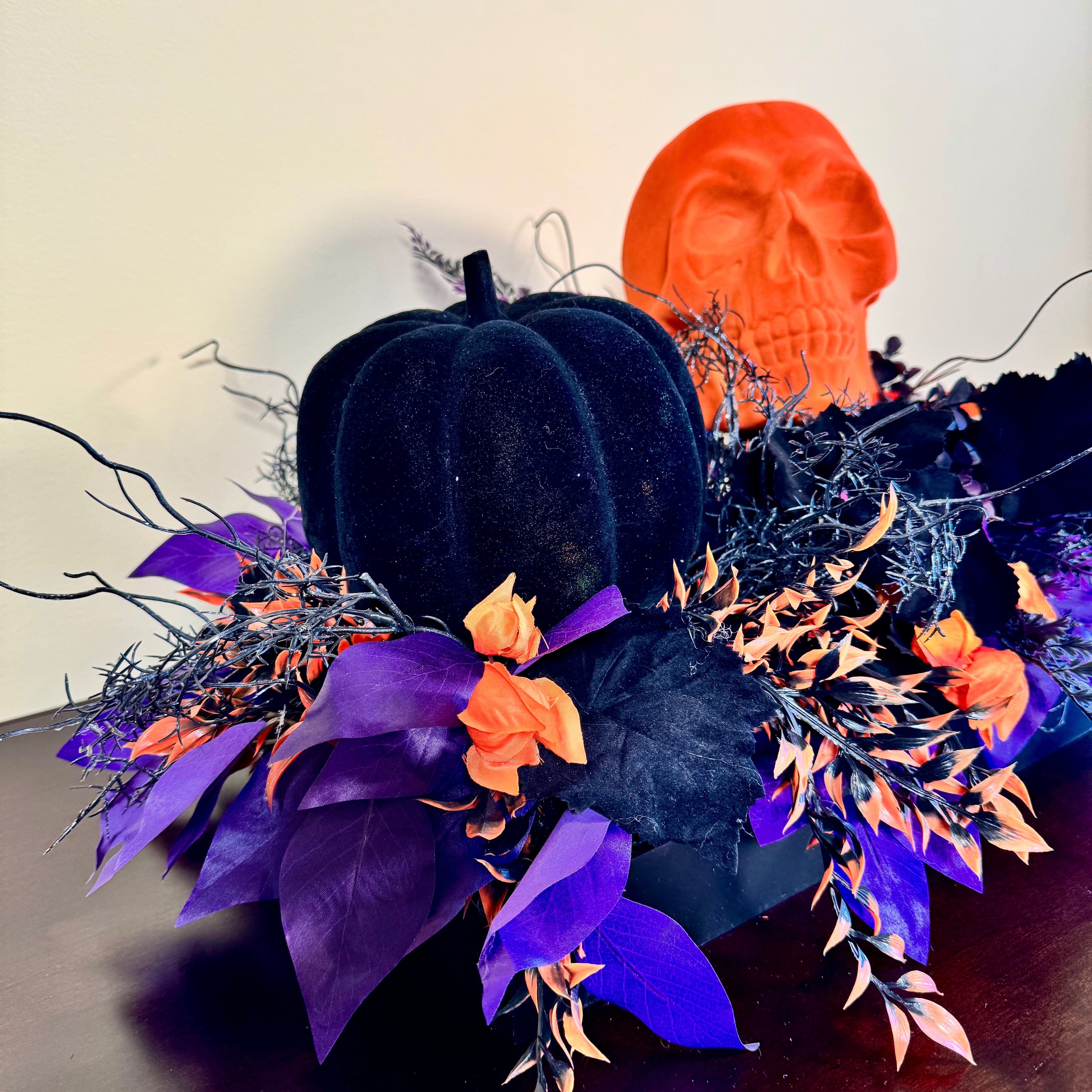 Halloween Arrangement with Neon Skull, Velvet Pumpkin & Bold Foliage in Black Wooden Tray