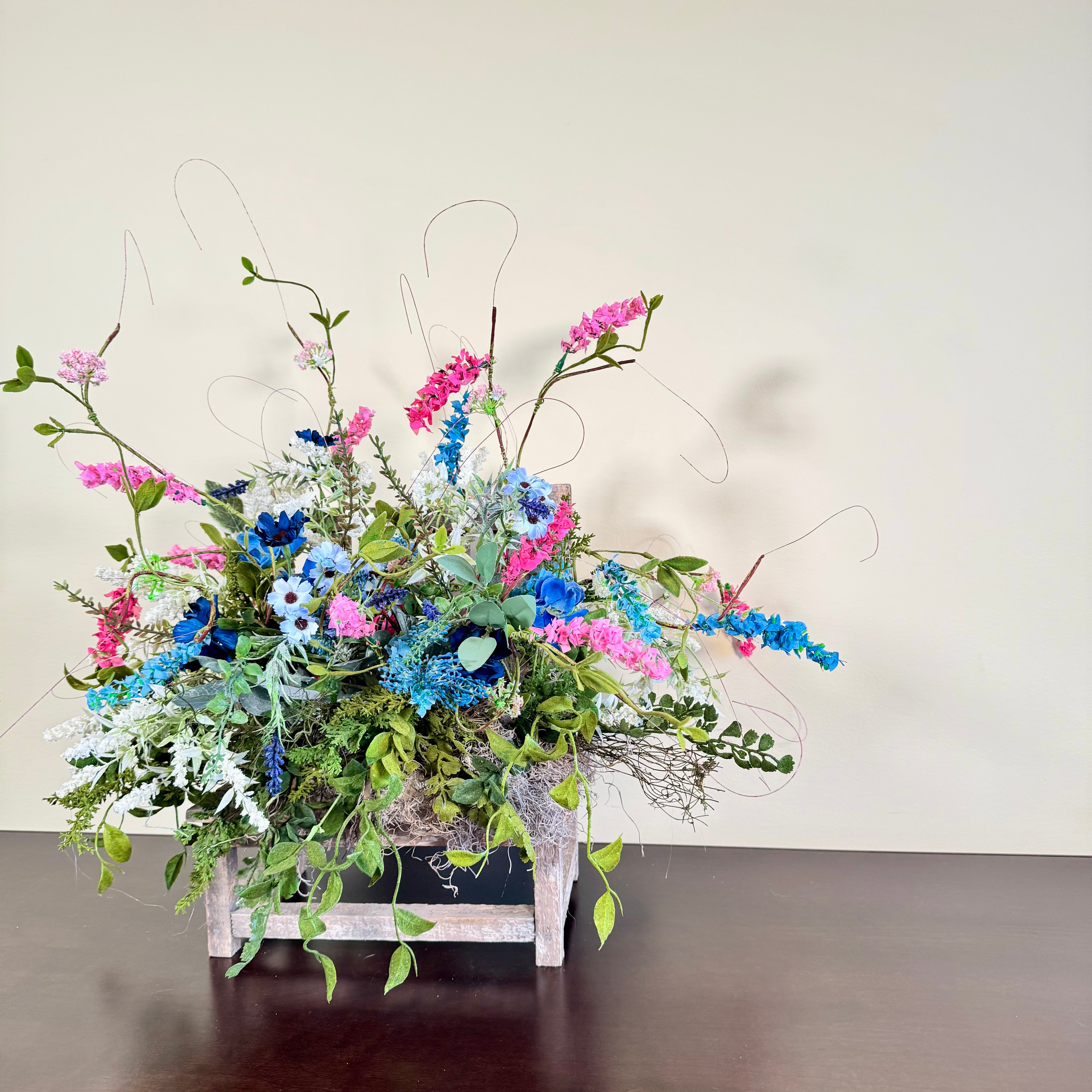 Wildflower Meadow Arrangement with Pink and Blue Blooms on Weathered Wooden Bench