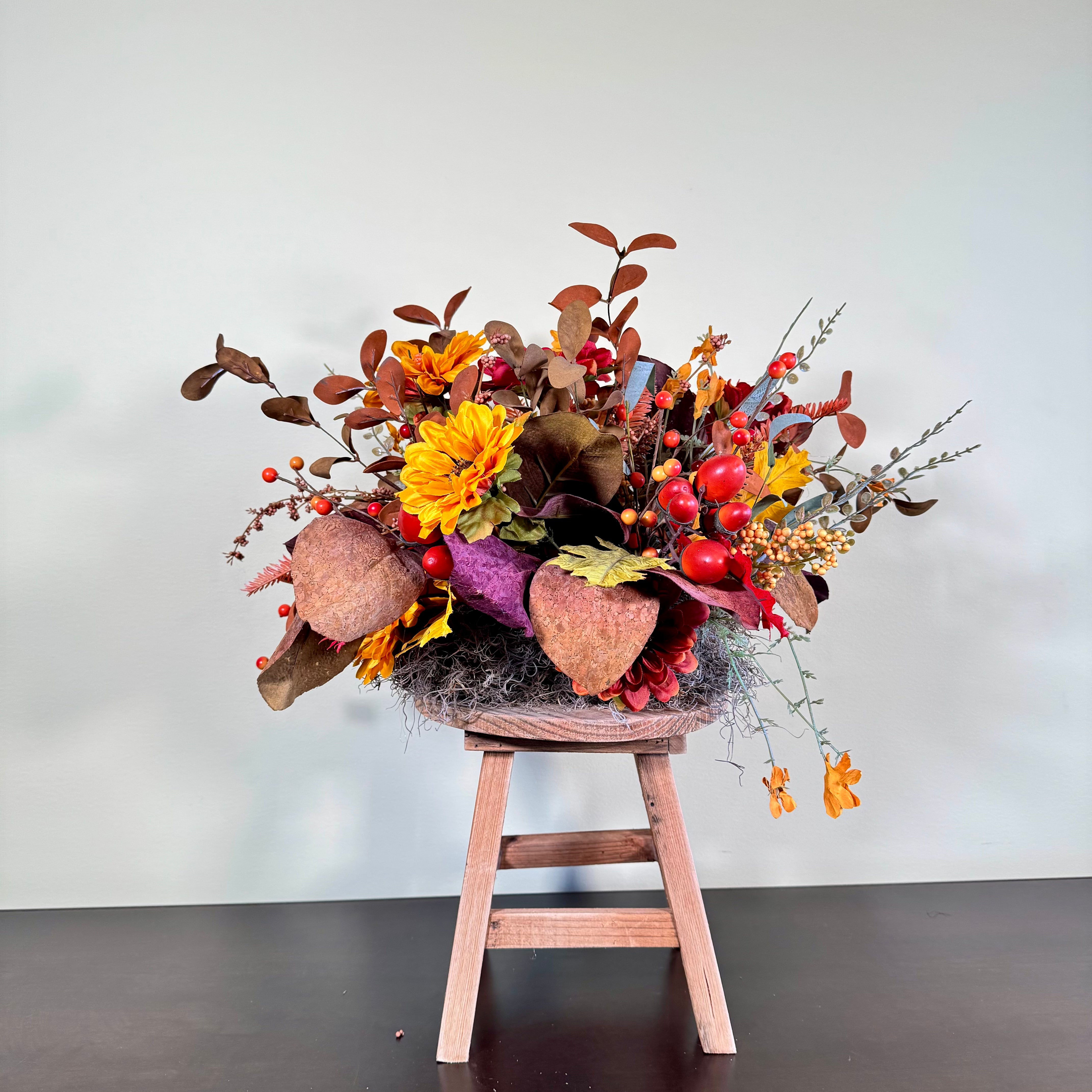 Fall Floral Arrangement with Sunflowers Berries and Leaves on Rustic Wood Stand