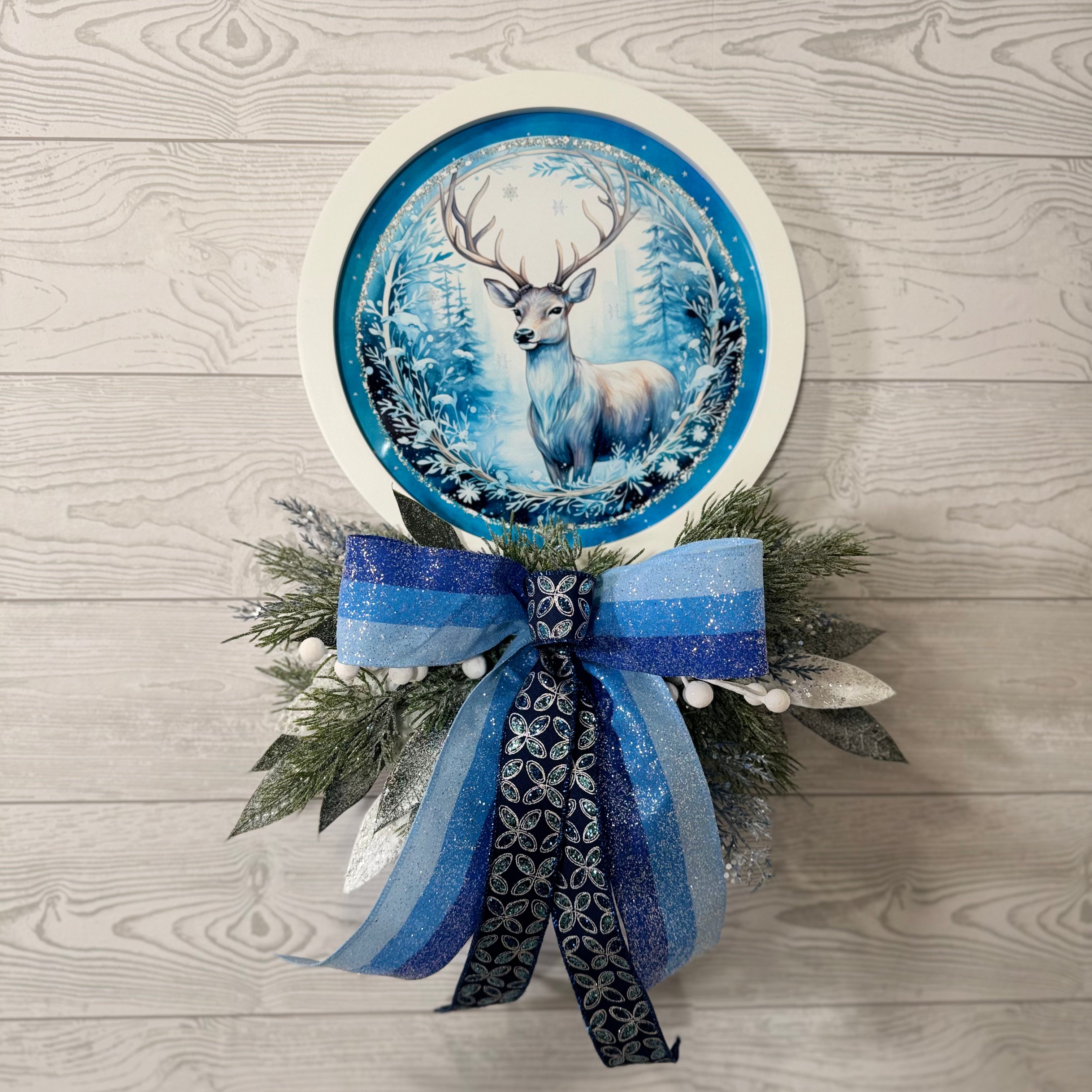Blue Winter Deer Wall Decor with Frosted Greenery and Sparkling Holiday Bow, Elegant Christmas Wall Accent
