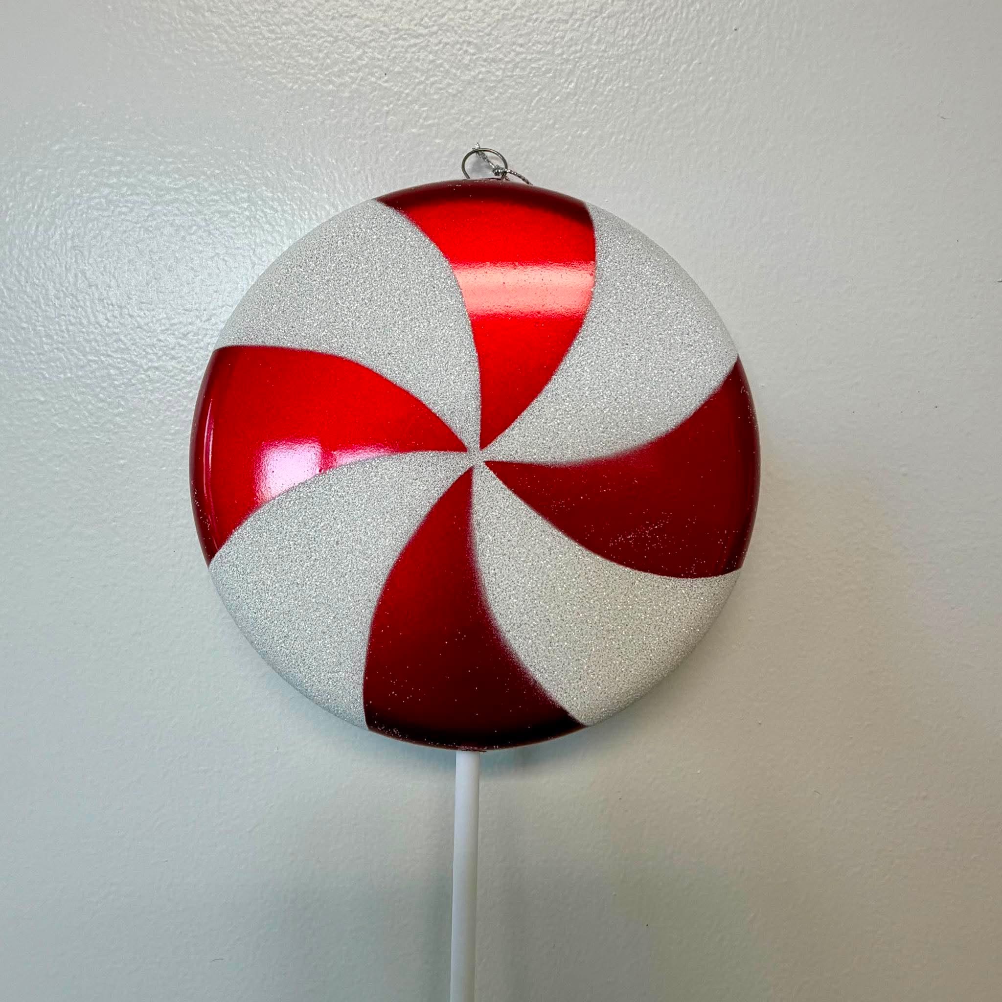 Close Up of Red White Peppermint Swirl Candy Lollipop Christmas Ornament Pick