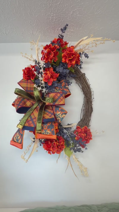 Video of the orange and navy blue hydrangea fall grapevine wreath shown from several angles