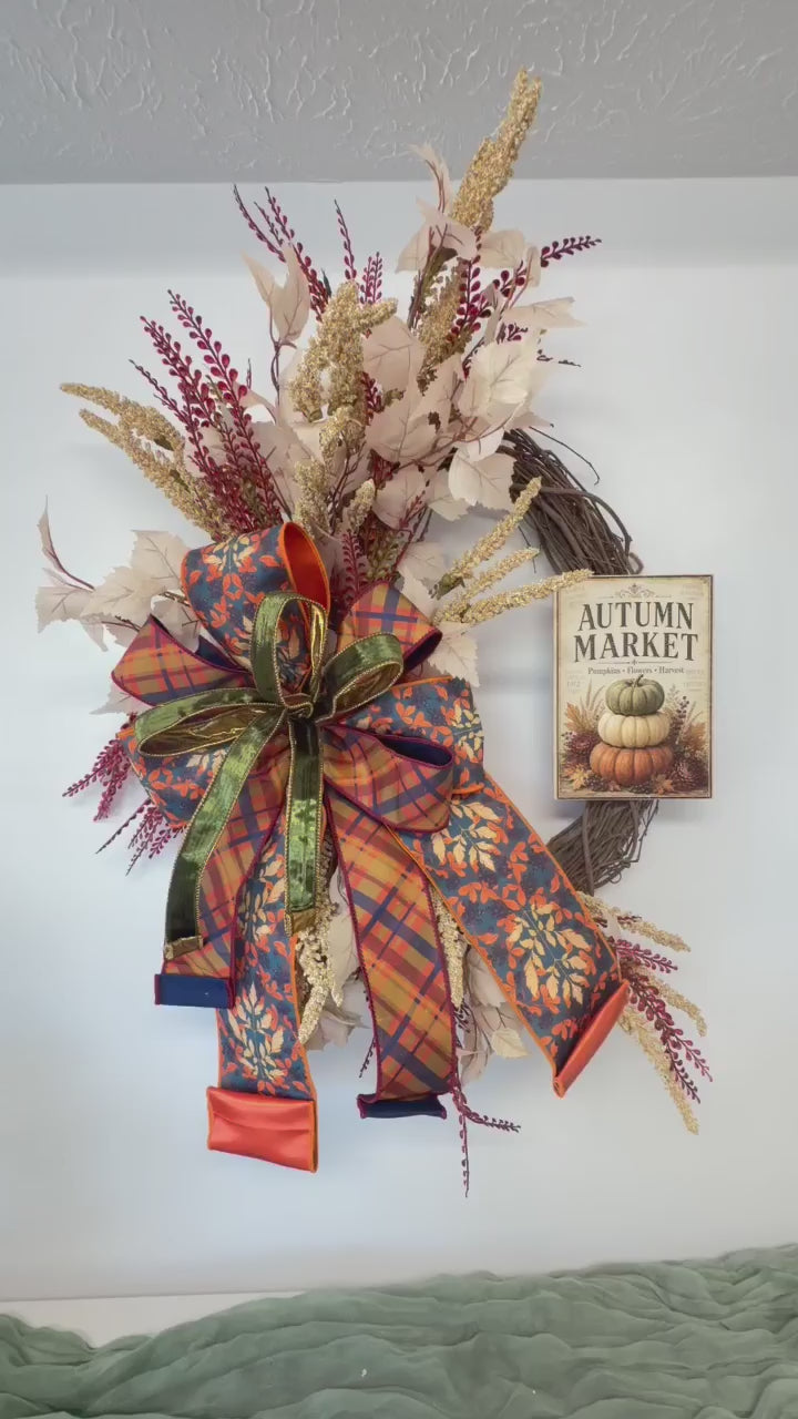 Video of the Autumn Market pumpkin sign fall grapevine wreath shown from several angles